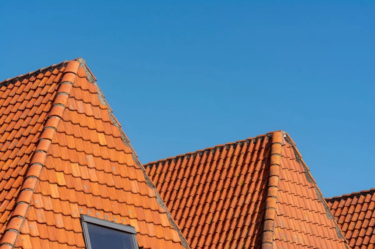 Clay barrel tile rooflines on homes in Norman, OK
