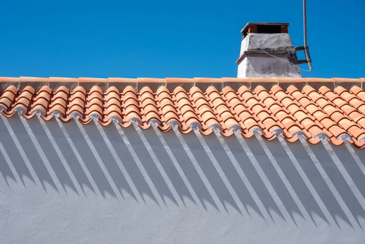 Roof ridge line and chimney on a home in Norman, OK