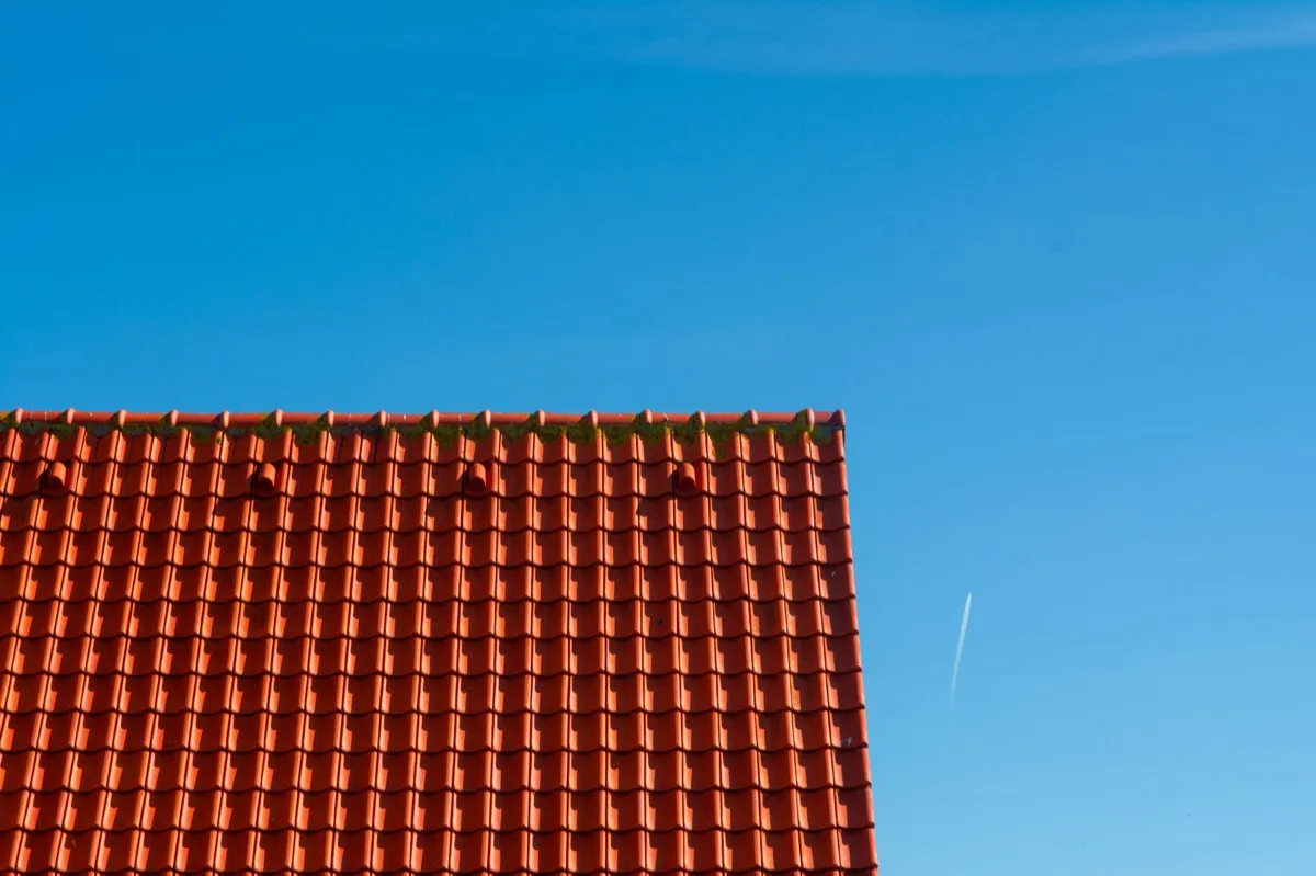 Tile roof gable in full sun, the kind of exposure that sets roof life in Norman, OK